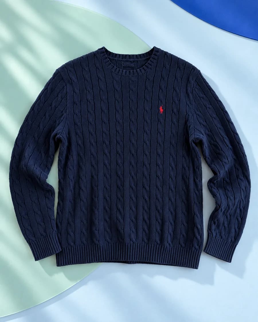 Illustration of the enhanced navy sweater photo in the listing draft